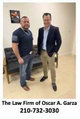 Two men standing next to each other in a room.